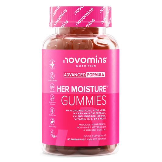 Front of a Novomins Her Moisture Gummies bottle with a pink label and cap, listing hyaluronic acid, aloe vera, marshmallow extract and vitamins D, E and B7, with vegan, gluten free and cruelty free badges. 60 pineapple flavoured gummies.